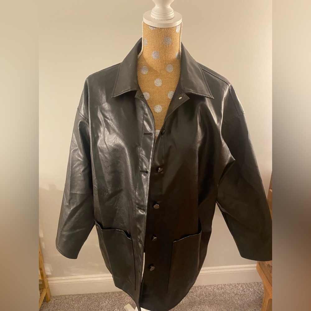 Black, leather like material, never worn